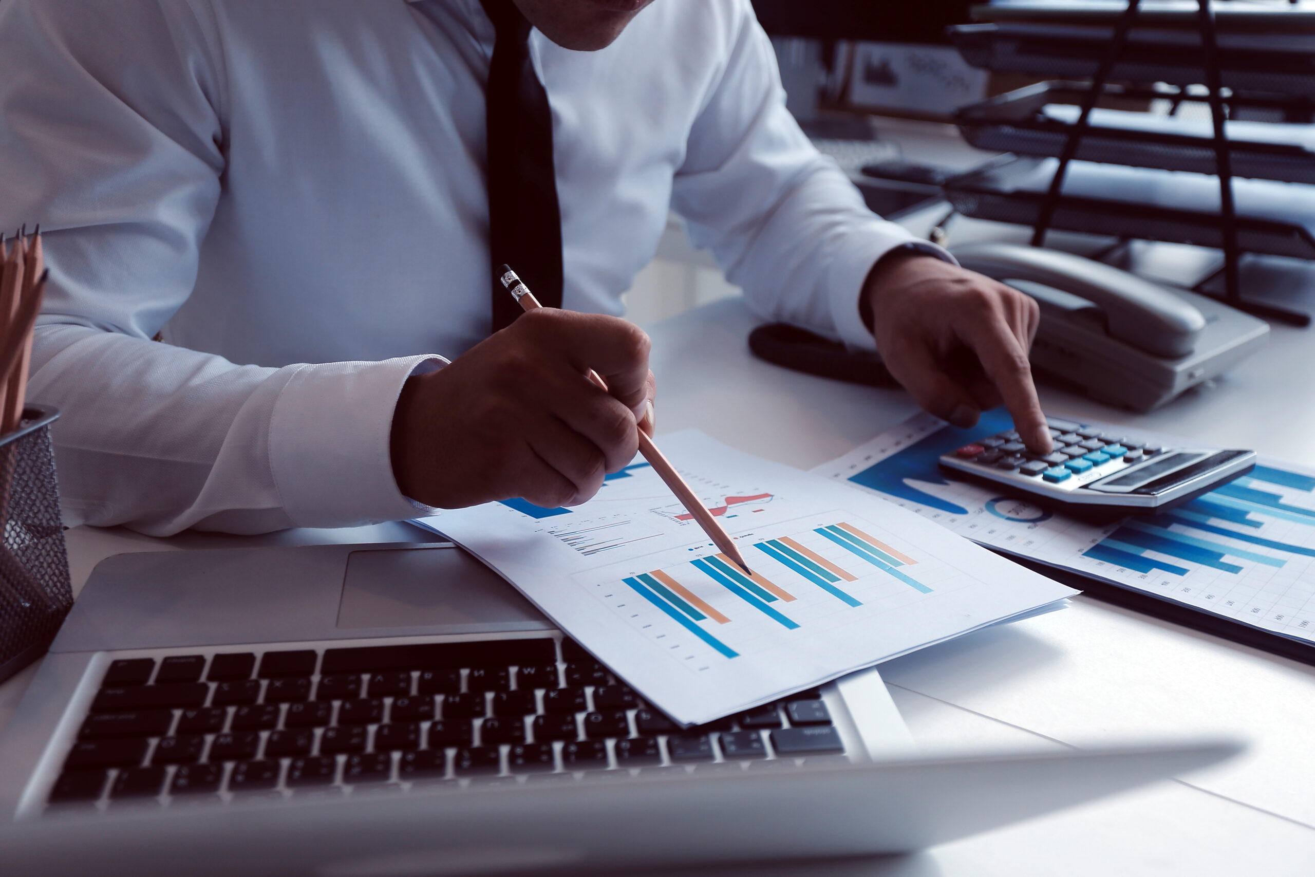 Team of business people are meeting to analyze data for marketin