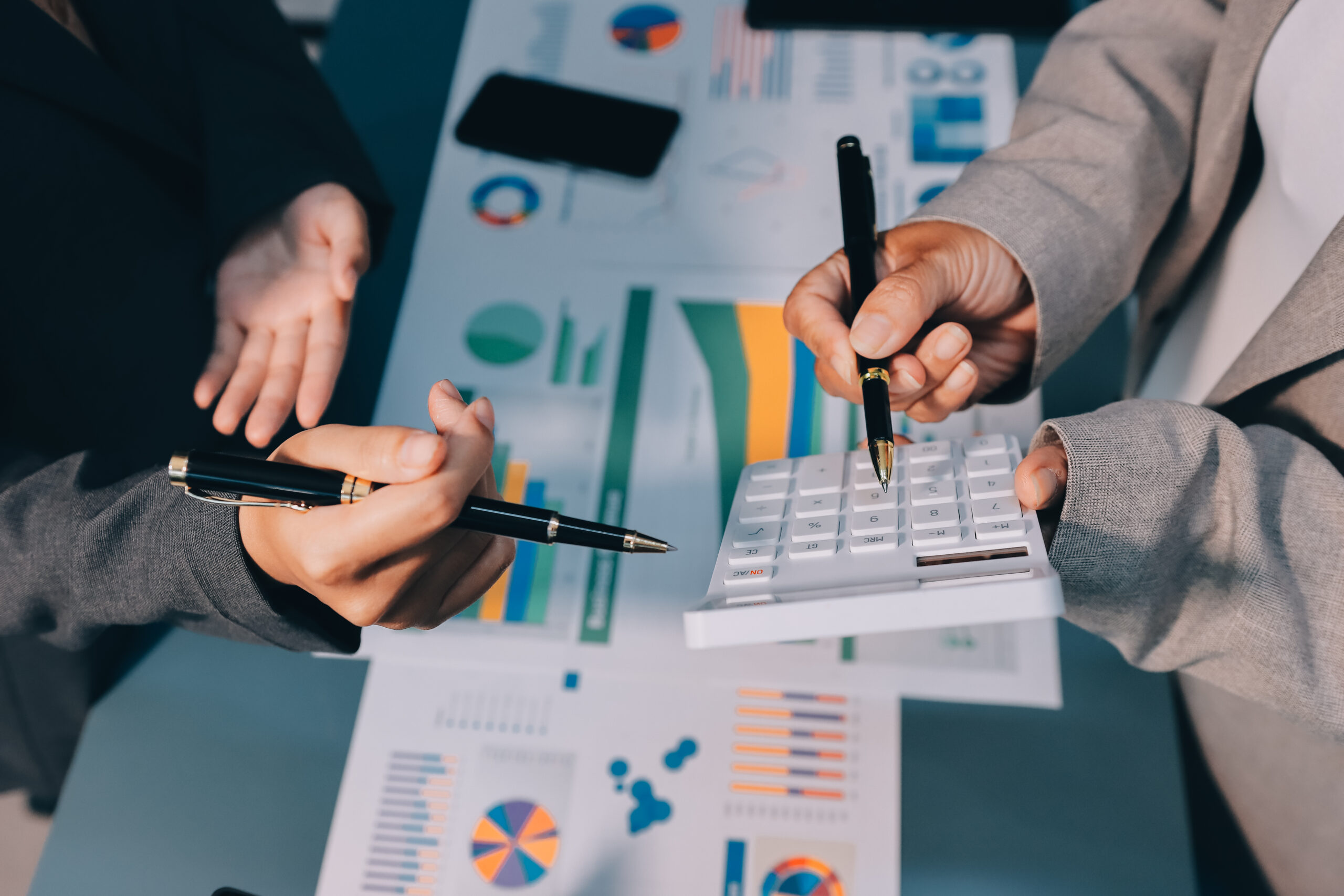 Team of business people are meeting to analyze data for marketin