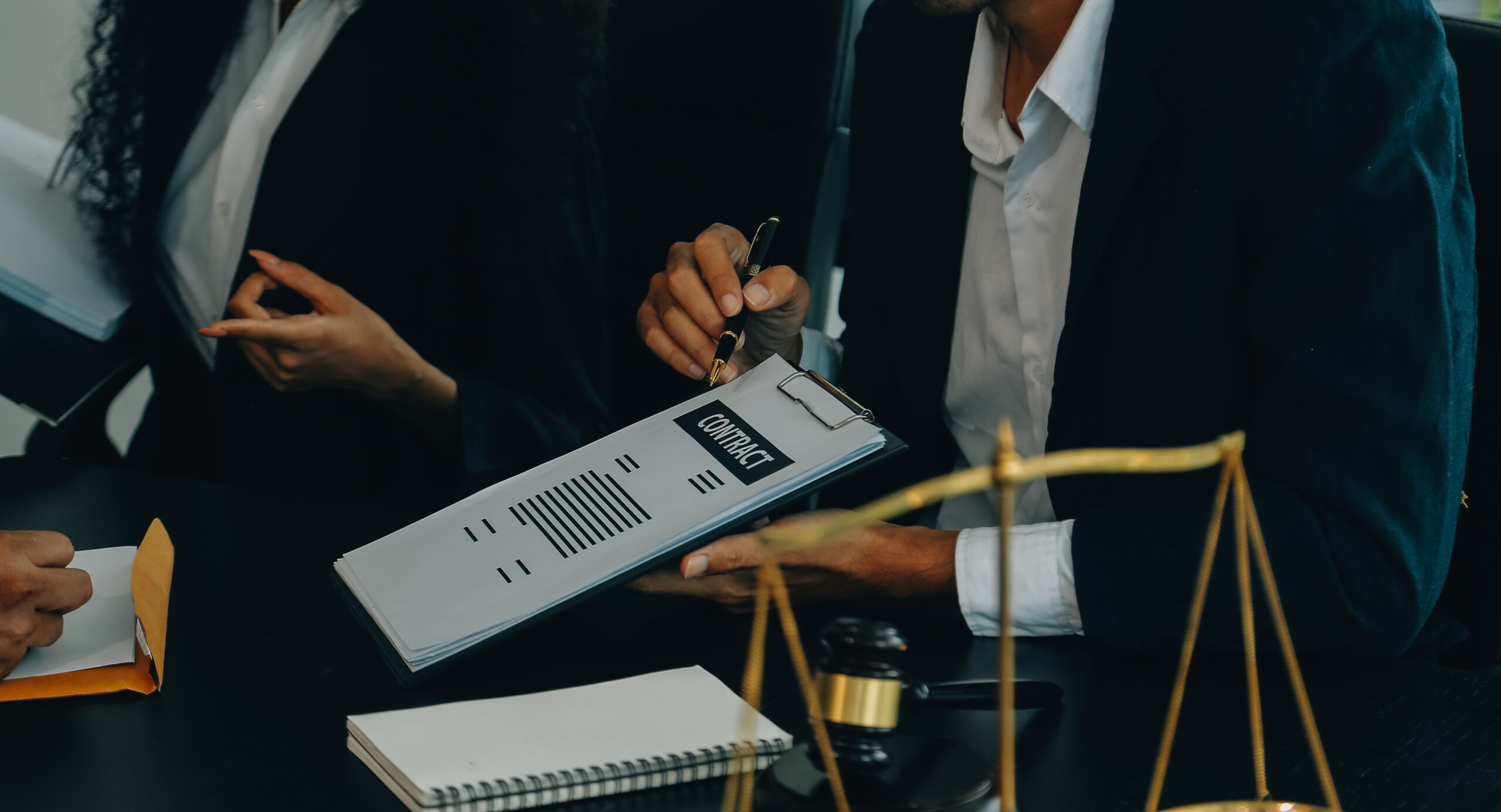 Judge gavel with Justice lawyers having team meeting at law firm