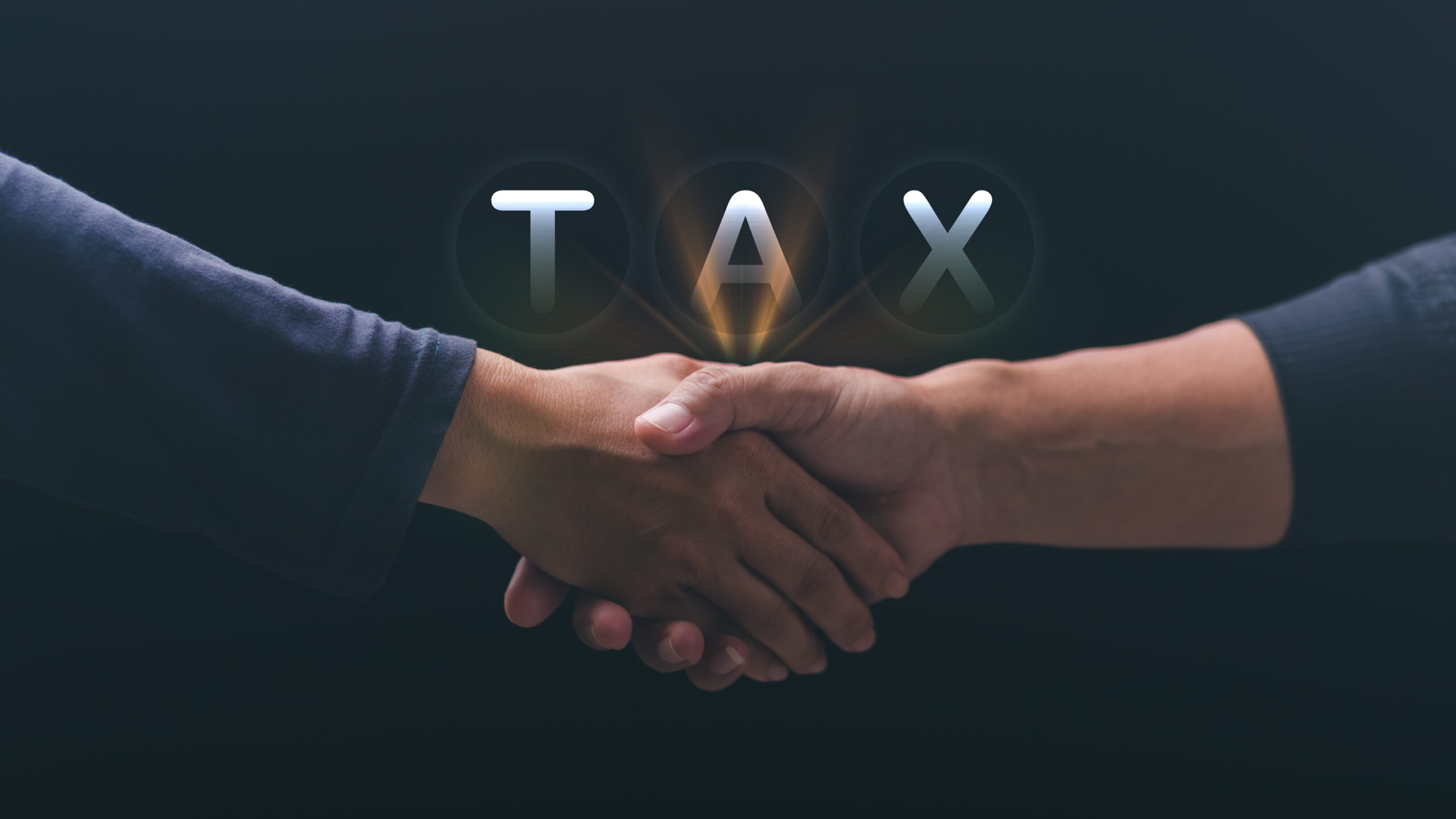 Business people shaking hands. Effective tax deduction planning
