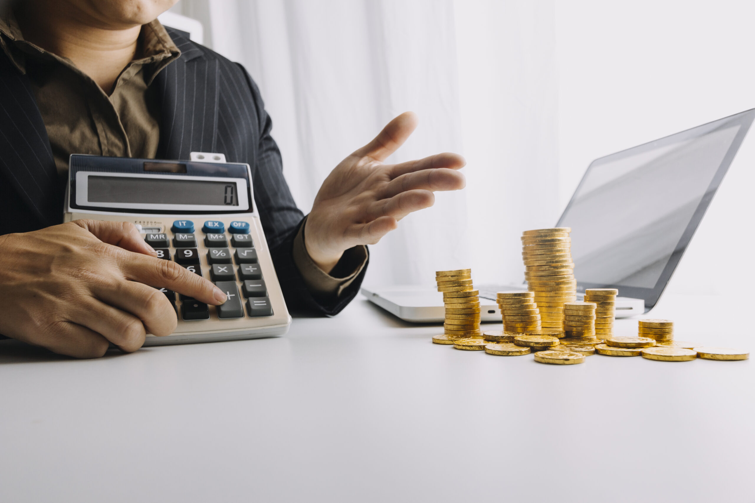 Business accounting concept, Business man using calculator with