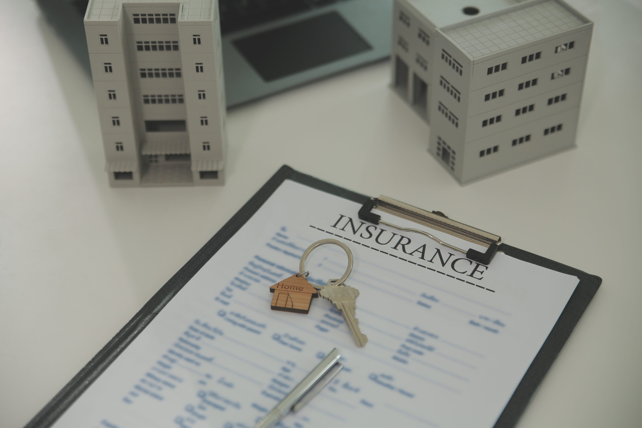 Real estate agent home sales broker is using a pen pointing to t